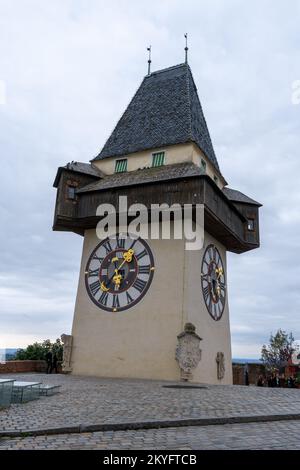 Graz, Austria - 9 October, 2022: view of the landmark medieval clock ...