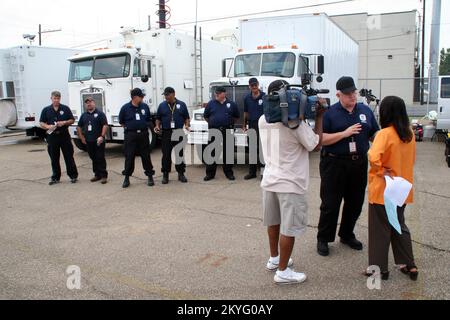 Hurricane Katrina/Hurricane Rita, Baton Rouge, LA, June 14, 2006 - A news crew interviews a FEMA Public Information Office at a demonstration of FEMA's Mobile Response Information Center (MRIC) and Mobile Disaster Recovery Center (MDRC) vehicles. This is part of the Louisiana Joint Field Office Operations Exercise where Federal, state and local emergency management personnel test and refine practices to be used in response to future hurricanes in Louisiana. Robert Kaufmann/FEMA Stock Photo