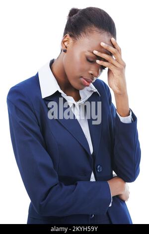Work related stress headaches. Studio shot of a young businesswoman touching her aching head isolated on white. Stock Photo