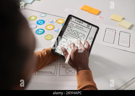 UX drawing sketch of new mobile app interface on tablet computer Stock Photo
