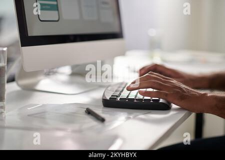 Hands of UX designer working on new project, creating interface for mobile application Stock Photo