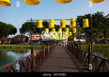 Antique wooden bridge for thai people and foreign travelers walking ...