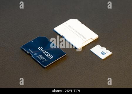 Fast SD Card and Micro SD card with adapter on grey textured background Stock Photo