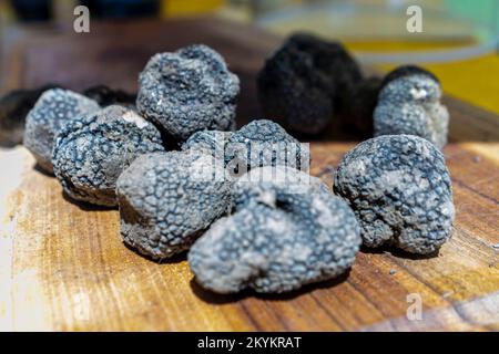 Fresh black truffles before they are served with some delicious food. Stock Photo