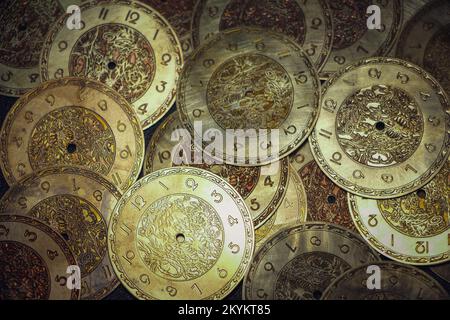 Close-up photo stack of spare parts for production of watches, engraved details of hand-made watches, selective focus Stock Photo