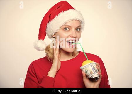 Totally natural lemon juice. Fresh lemonade drink with straw. Symbol of wealth and richness. Girl with lemon and money. Lemon money concept. Girl Stock Photo