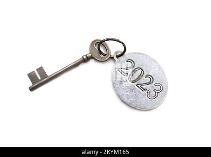 2023 engraved on a ring of an old key isolated on white background Stock Photo