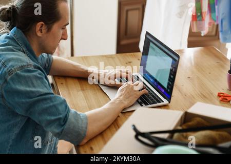 Man working on laptop Stock Photo