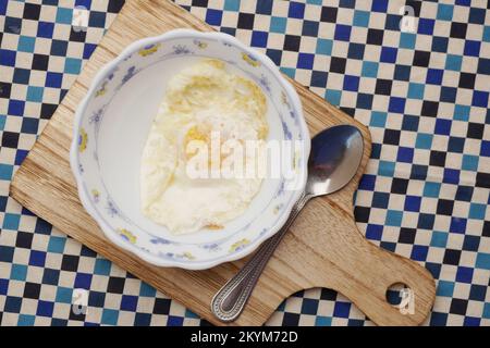 Fried eggs in the plate close up , Stock Photo