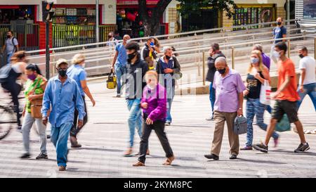 Pedestrians, old men, old women, low income people crossing a street in downtown Belo Horizonte, Brazil. Stock Photo