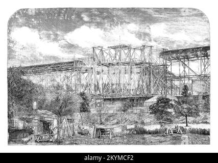 The building of the 1862 Great Exhibition building, a mixed structure of brick, iron, glass, timber and stone, covering some 23½ acres. From May to the end of October 1862 over six million visitors came to South Kensington in London, England, to view an international exhibition of art and industry. At the conclusion, the gigantic structure was to disappear unregretted almost as quickly as it was built. Stock Photo