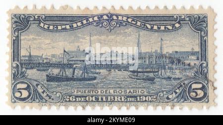 ARGENTINA - 1902: 5 centavos deep blue postage stamp depicting panorama of the River Port of Rosario. Completion of port facilities at Rosario. The Port of Rosario is an inland port and a major goods-shipping center of Argentina, located in the city of Rosario, province of Santa Fe, on the western shore of the Parana River, about 550 km upstream from the Atlantic Ocean. The port is the largest of a series located in the several cities of the Greater Rosario that lie on the Paraná; the last (northernmost) able of overseas traffic being Puerto General San Martín (23 km upstream from Rosario)