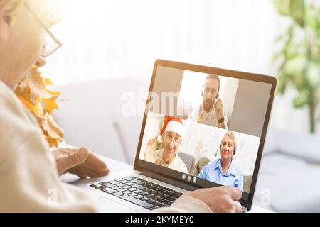 Online conference of colleagues through a laptop. Video call for training. Educational webinar chat between different people. Team meeting Stock Photo