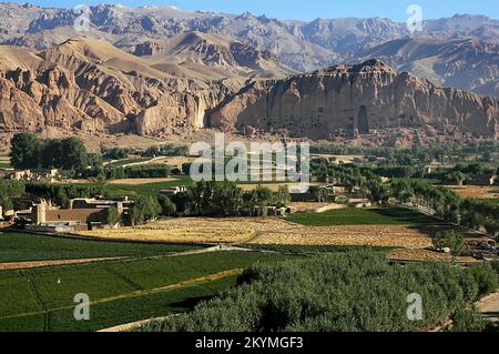 Bamyan (Bamiyan) in Central Afghanistan. View over the Bamyan (Bamiyan) Valley showing the small Buddha niche in the cliff. Stock Photo