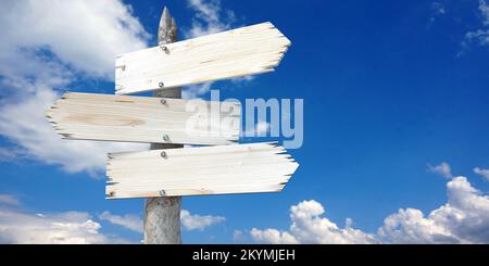 Wooden signpost with clear three arrows Stock Photo