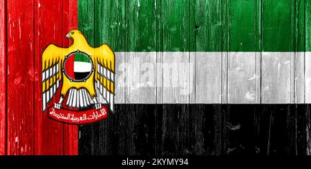 Flag and coat of arms of the United Arab Emirates on a textured background. conceptual collage.