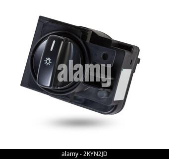 Close-up on the headlight switch control buttons and automatic adjust level dashboard of car in the vehicle repair workshop on white isolated backgrou Stock Photo