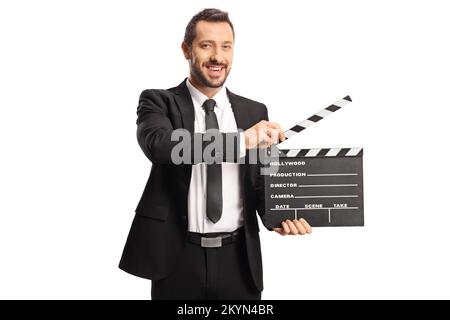Man in suit and tie holding a movie clapperboard isolated on white background Stock Photo