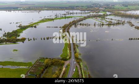 Picture dated November 27th shows the  A1101 road surrounded by flooded fields in Welney,Norfolk, on Sunday after recent heavy rain caused the River D Stock Photo
