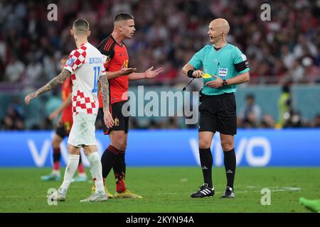 Al Rayyan, Qatar. 1st Dec, 2022. Leander Dendoncker (C) of Belgium reacts after receiving a yellow card from referee Anthony Taylor during the Group F match between Croatia and Belgium at the 2022 FIFA World Cup at Ahmad Bin Ali Stadium in Al Rayyan, Qatar, Dec. 1, 2022. Credit: Zheng Huansong/Xinhua/Alamy Live News Stock Photo