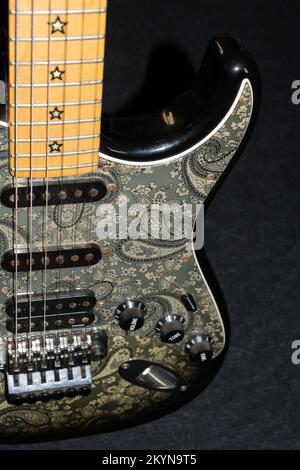 Vaduz, Liechtenstein, January 12, 2022 Product shot of a Fender Stratocaster Richie Sambora signature electric guitar painted in black paisley Stock Photo