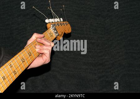 Vaduz, Liechtenstein, January 12, 2022 Artist is playing with a Fender Stratocaster Richie Sambora signature electric guitar Stock Photo