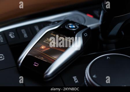 MOSCOW, RUSSIA - FEBRUARY 05, 2022. BMW smart key close up view. Modern BMW wireless car key. Translation: 'Power reserve information. Power reserve. Stock Photo