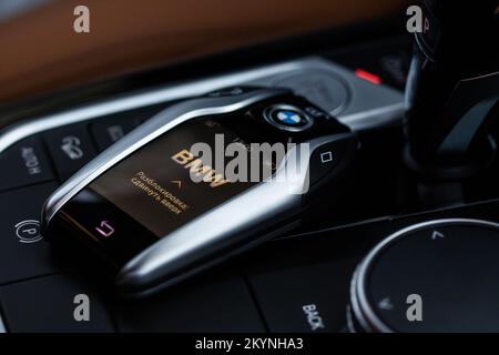 MOSCOW, RUSSIA - FEBRUARY 05, 2022. BMW smart key close up view. Modern BMW wireless car key. Translation: 'Unlock: slide up' Stock Photo