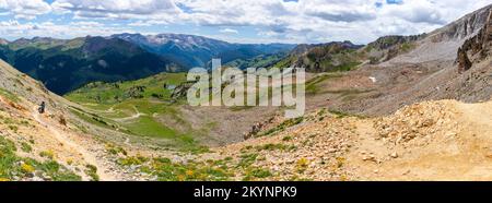 Backpackers climb toward Trail Rider Pass along  the Four Passes Loop, a hiking and backpacking trail near Aspen and Snowmass, Colorado, USA. Stock Photo