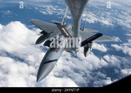 Pacific Ocean, International Waters. 30th Nov, 2022. Pacific Ocean, International Waters. 30 November, 2022. A U.S. Air Force F-15C Eagle fighter jet, assigned to the 18th Fighter Wing, approaches a KC-135 Stratotanker refueling aircraft during a patrol mission, November 30, 2022 over the Pacific Ocean. Credit: A1C Tylir Meyer/U.S. Air Force/Alamy Live News Stock Photo