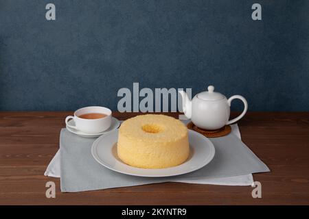 plain chiffon cake hot tea set isolated on white background Stock Photo
