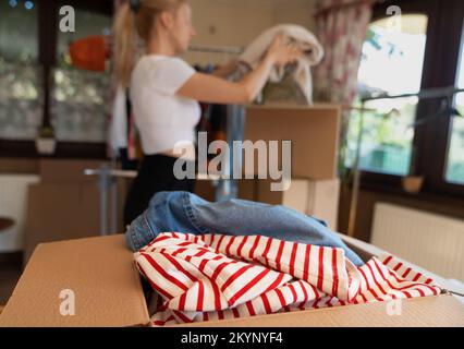 Pre owned clothes resale or donation. Stock Photo