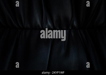 Black leather background in darkness Stock Photo