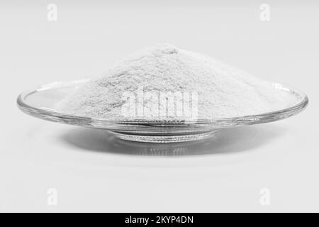 Dicalcium phosphate, known as dibasic calcium or monohydrogen calcium phosphate, powder or microgranules can be used in mixtures for animal feeds with Stock Photo
