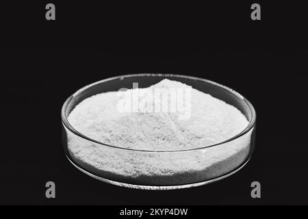 Dicalcium phosphate, known as dibasic calcium or monohydrogen calcium phosphate, powder or microgranules can be used in mixtures for animal feeds with Stock Photo