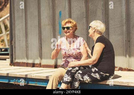 Two elderly women are happy to meet each other Stock Photo