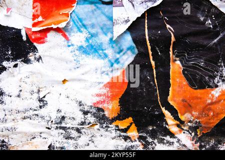 Old grunge torn collage posters creased crumpled paper placard texture background. Ripped faded paper backdrop surface placard Stock Photo