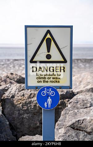Unstable Rocks Sign Safety warning sign unstable rocks at Hopewell Rocks Provincial Park in ...