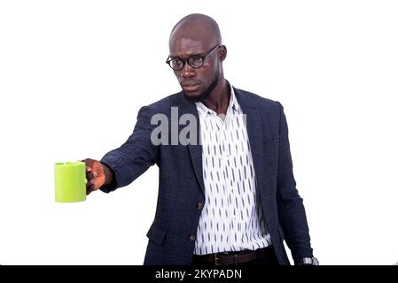 portrait of a serious adult businessman giving a cup of coffee. Stock Photo