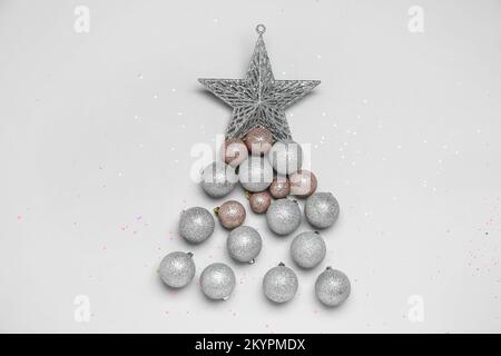 Christmas tree made of shiny balls with star on grey background Stock Photo