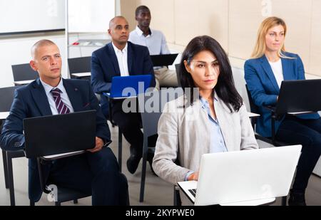 international group of managers with laptop in advanced training courses Stock Photo