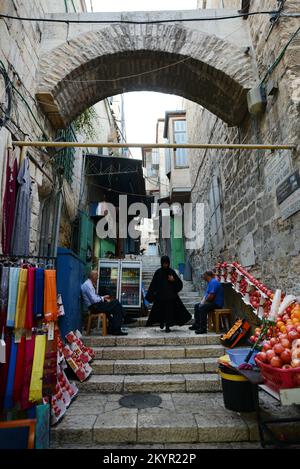 A Coptic nun walking on Al Aqbat street in the Christian quarter in the old city of Jerusalem. Stock Photo