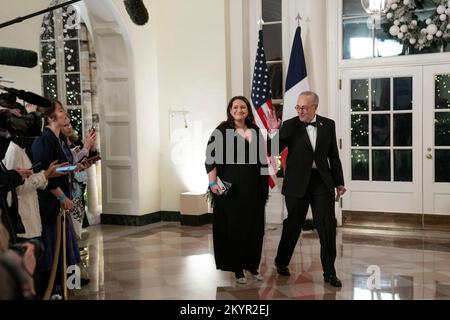 Washington, DC, US, December 1, 2022,Senate Majority Leader Charles Schumer, D-New York, and daughter Jessica Schumer arrive to attend a State Dinner in honor of President Emmanuel Macron and Brigitte Macron of France hosted by United States President Joe Biden and first lady Dr. Jill Biden at the White House in Washington, DC on Thursday, December 1, 2022Credit: Sarah Silbiger / Pool via CNP Stock Photo