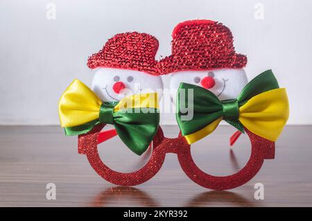 Christmas festive glasses with snowmen with bow ties with brazil colors, Christmas concept in brazil. Stock Photo