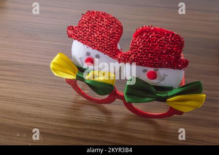 Christmas festive glasses with snowmen with bow ties with brazil colors, Christmas concept in brazil. Stock Photo