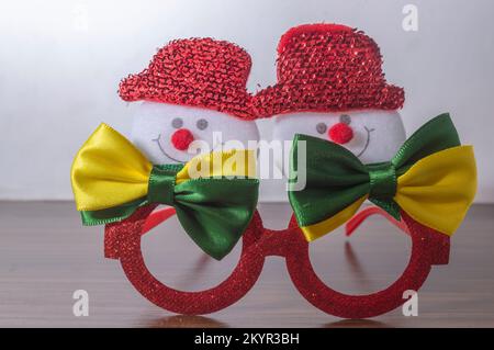 Christmas festive glasses with snowmen with bow ties with brazil colors, Christmas concept in brazil. Stock Photo
