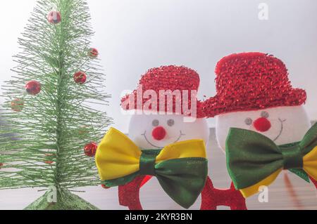 Christmas festive glasses with snowmen with bow ties with brazil colors, Christmas concept in brazil. Stock Photo