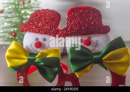 Christmas festive glasses with snowmen with bow ties with brazil colors, Christmas concept in brazil. Stock Photo