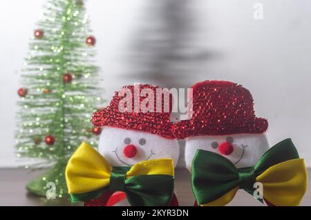 Christmas festive glasses with snowmen with bow ties with brazil colors, Christmas concept in brazil. Stock Photo