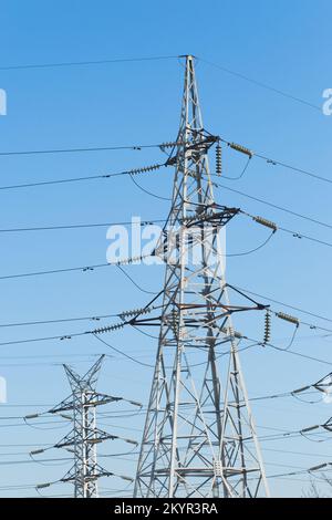 Electricity voltage high energy power technology electrical tower industry line electric blue sky. Stock Photo